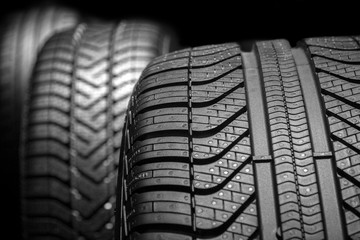  car tyres profile on a black background