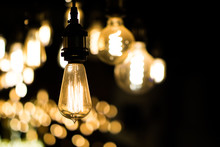 Vintage Light Bulbs Hanging In The Night Time, Dark Background