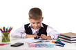 © Александр Кузнецов - Smart serious pupil at the desk exploring with magnifier on the clean white background