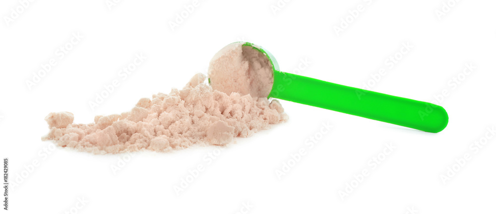 Measuring scoop with protein powder on white background