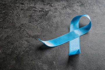 Canvas Print - Blue ribbon on grey background. Cancer awareness concept