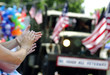 hands clapping veterans parade American flag patriotism