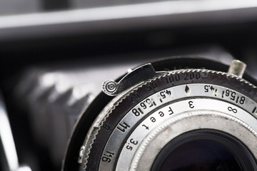 Macro photo of the lens of an antique camera. Shallow depth of field.