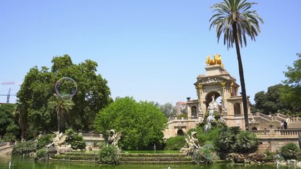 Canvas Print - Soap colorful bubbles flying in Park de la Ciutadella of Barcelona, Spain