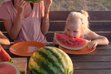 funny kid girl eat watermelon slices