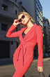 © xo4uphoto - Fashionable blonde woman in red suit and sunglasses