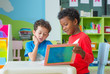 © weedezign - Two boy kid sit on table and reading tale book  in preschool library,Kindergarten school education concept