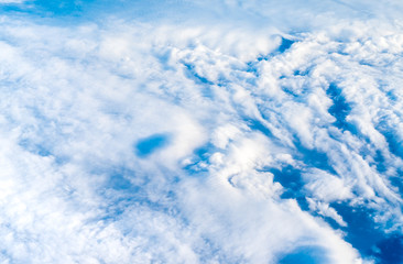 Wall Mural - blue sky and cloud (cirrocumulus)top view from airplane window,nature background..