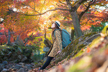 Asian Woman Is Enjoy Travel In Japan During Autumn.