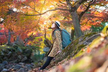 Wall Mural - asian woman is enjoy travel in japan during autumn.
