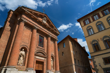 Wall Mural - Beautiful spring cityscape. Church of Saint Christopher (San Cristoforo), Siena, Italy.