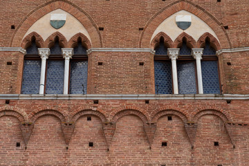 Wall Mural - Architectural detail of the Palazzo Pubblico at the Piazza del Campo in Siena, Italy, Europe