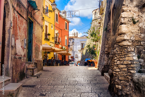 Fotografie, Obraz colorful south italy village alley in Apulia in the town of Vico del Gargano