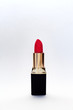 red lipstick on white background .