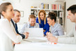 © NDABCREATIVITY - Business people discussing future plans