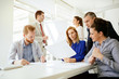 © NDABCREATIVITY - Businesspeople and architects planning