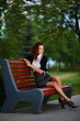 © Aliaksei Lasevich - beautiful girl sitting on bench in park