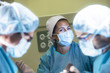 © Jose Luis Carrascosa Martinez/ADDICTIVE STOCK - Woman working with doctors in operating room