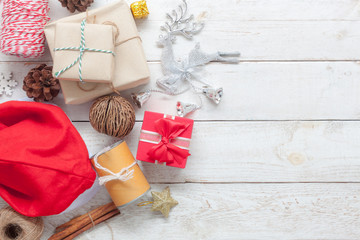 Wall Mural - Table top view aerial image of items decor Merry Christmas & Happy new year background concept.Beautiful decorations  on modern rustic white wooden at home office desk.Free space for creative text.