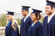 © Syda Productions - happy students or bachelors in mortar boards