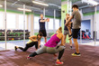 © Syda Productions - group of happy friends stretching in gym