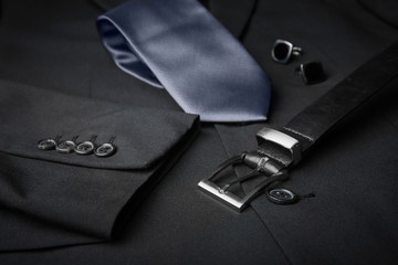 Wall Mural - Elegant tie, cuff links and belt on male jacket, closeup