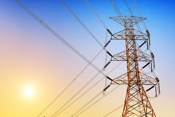 Wall Mural - high voltage post or high voltage tower at sunset