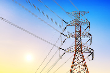 Wall Mural - high voltage post or high voltage tower at sunset