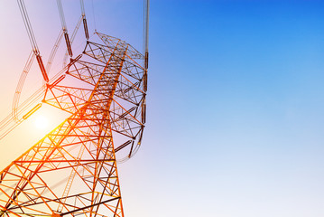 High voltage post or High voltage tower at sunset