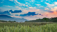 Landscape Field With Grass In Orange Sunset, Mountains And Clouds. Killarney National Park, Ireland