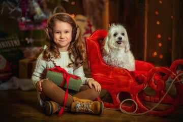  Little girl with dog at Christmas Eve