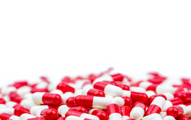 Wall Mural - Selective focus of antibiotic capsules pills on white background with copy space. Drug resistance concept. Antibiotics drug use with reasonable and global healthcare concept.