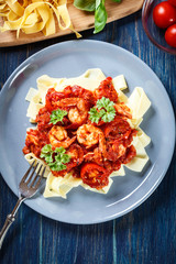 Wall Mural - Pappardelle pasta with shrimp, tomatoes and herbs