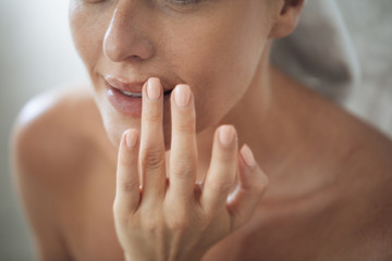 Poster - Woman Touching Her Lips