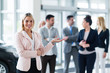 © NDABCREATIVITY - Picture of professional salesperson working in car dealership