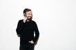 © Drobot Dean - Portrait of a cheerful bearded man talking on mobile phone