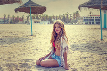 Blond Teen Girl Sit On The Beach Sand