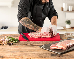 Poster - Man cooking meat steak on kitchen