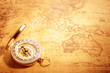 © bohbeh - Old vintage compass on vintage map