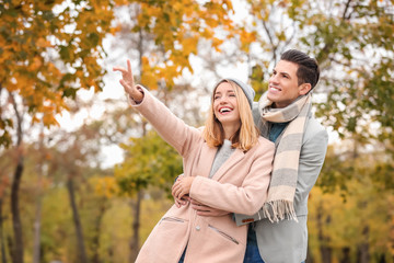 Sticker - Young couple in park on autumn day