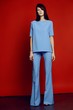 © EVGENY FREEONE - Woman in flared blue trousers