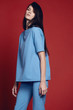 © EVGENY FREEONE - Woman in flared blue trousers