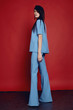 © EVGENY FREEONE - Woman in flared blue trousers