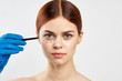 © SHOTPRIME STUDIO - girl in medical glove marks lines on her face
