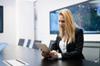 © NDABCREATIVITY - Beautiful businesswoman using digital tablet in office