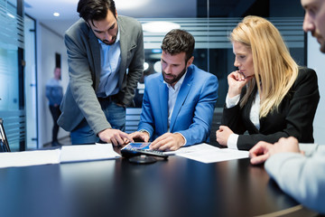 Business team working together on project in office