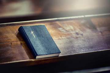 Book holy bible. Holy Bible on old wooden church table