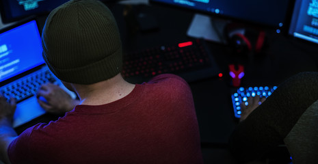 Caucasian man working on coding