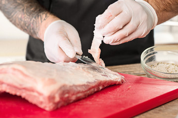 Wall Mural - Man cooking meat steak on kitchen