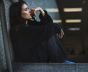 Wall Mural - Woman Sitting Look Worried on The Stairway